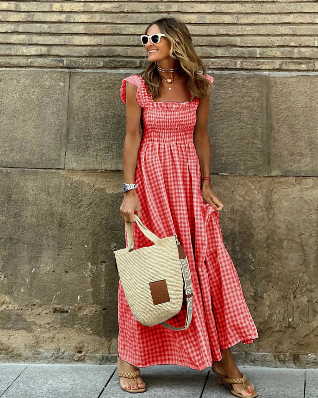 Red gingham smocked maxi dress with ruffled straps and flowing tiered hem