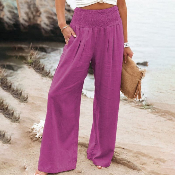 Magenta wide-leg linen-style trousers with smocked high waist detail