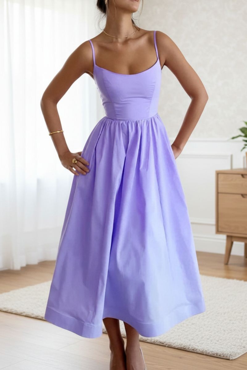 Lilac cocktail dress showing fitted bodice and flowing pleated skirt