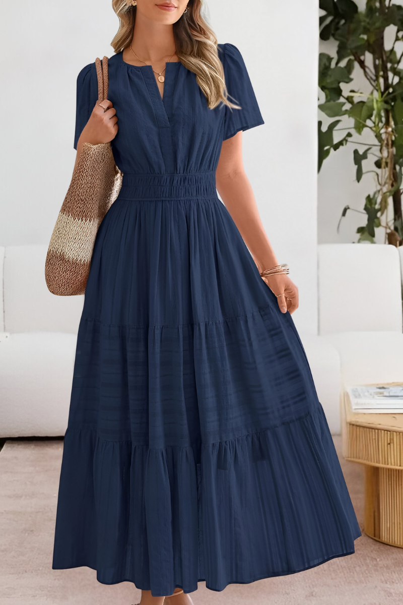 Navy tiered maxi dress with cinched waist and puff sleeves