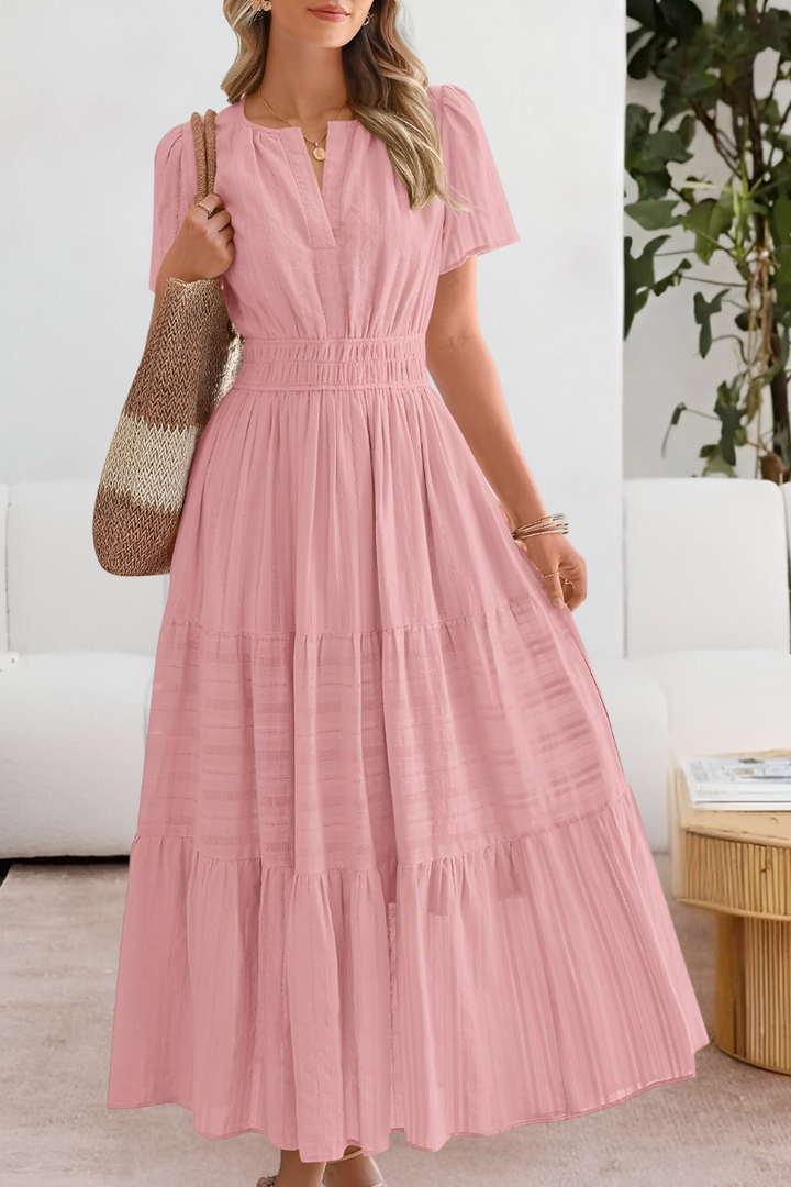 Dusky pink tiered maxi dress with cinched waist and short sleeves