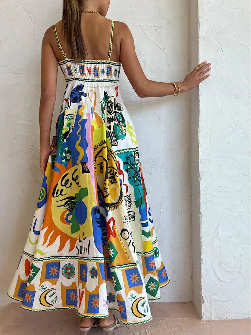 Rear view of colourful abstract print maxi dress with smocked bodice