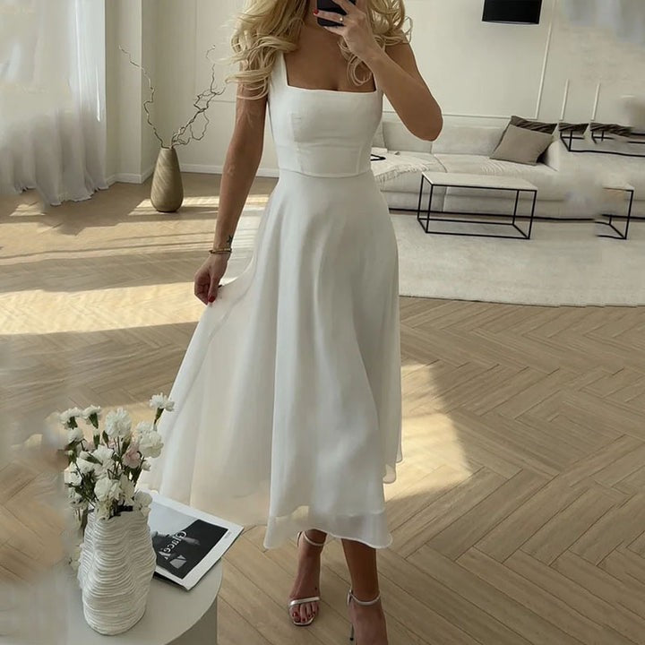 White square-neck sleeveless midi dress with flowing A-line skirt