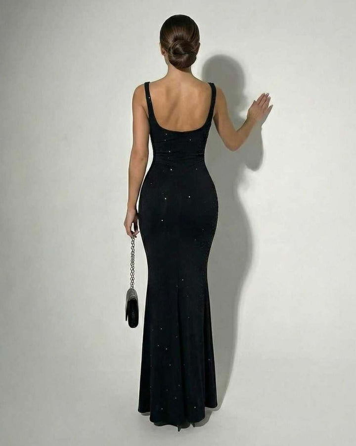 Backless view of black bodycon maxi dress showing scoop back and sequin sparkle