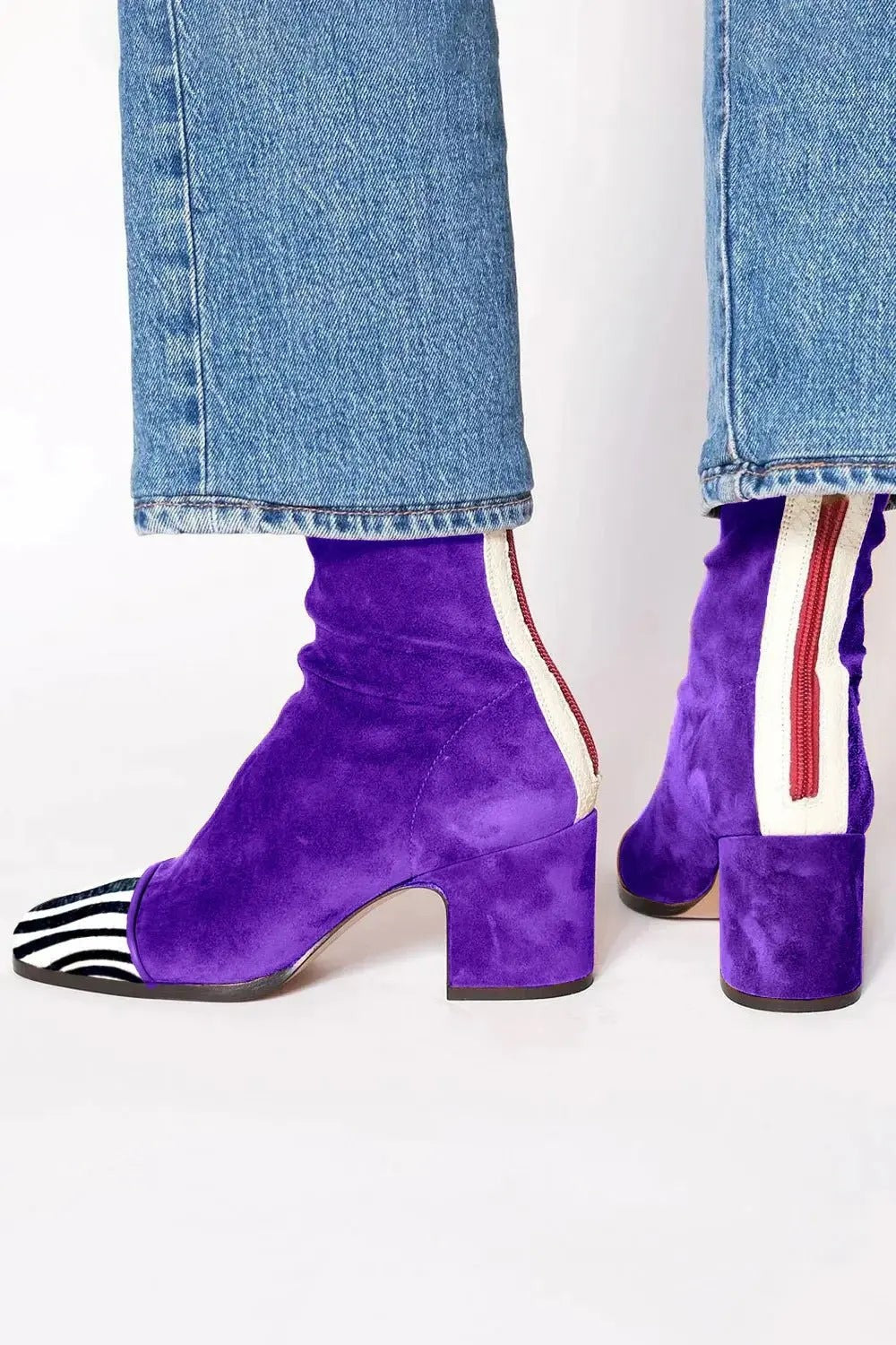 Purple suede ankle boots featuring zebra-print toe and chunky heel