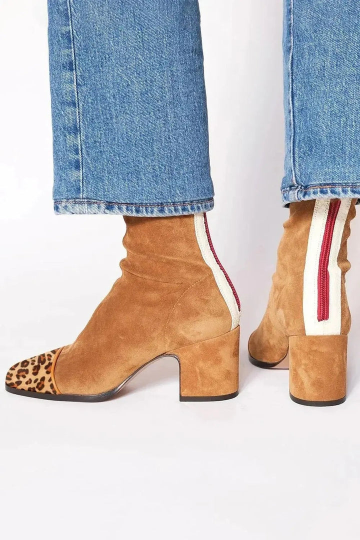 Tan suede ankle boots with leopard-print cap toe and stacked heel