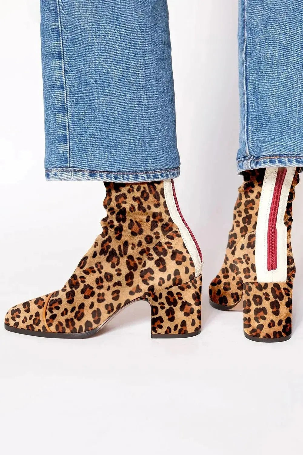 Leopard-print suede ankle boots showing red zip trim and block heel