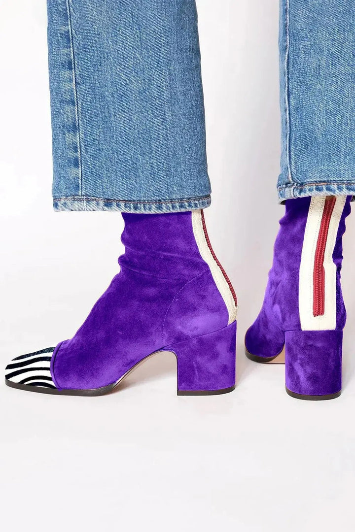 Purple suede block-heel boots with striped zip detail and zebra toe