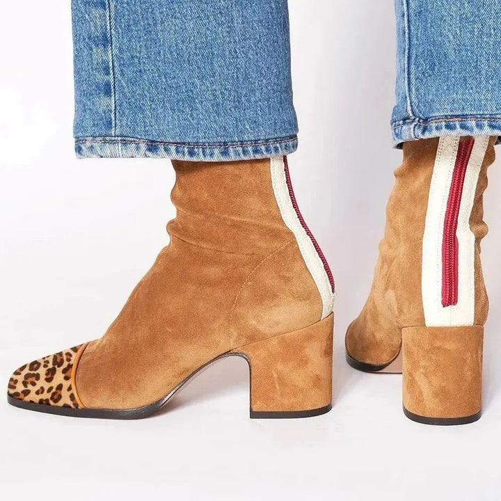 Tan suede ankle boots displaying leopard toe cap and cream zip stripe