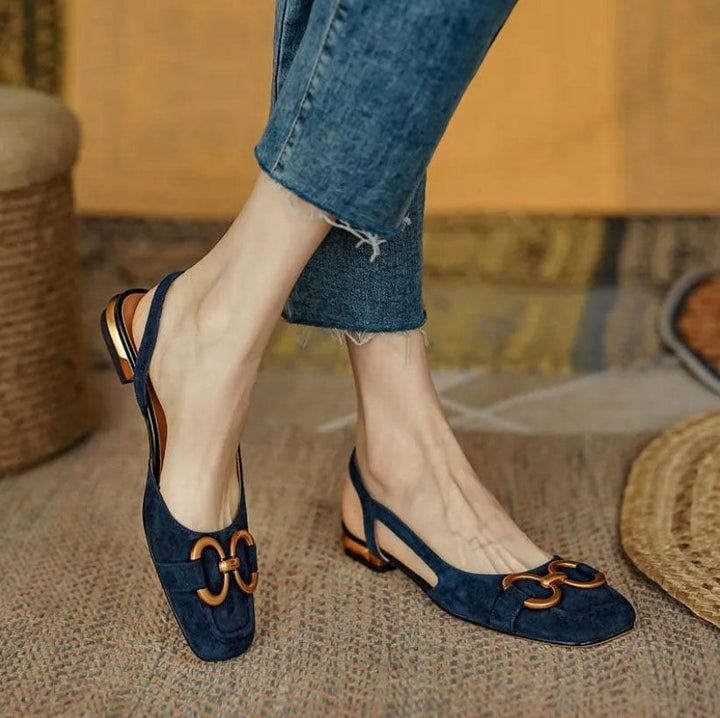 Navy suede slingback sandals with gold-tone chain buckle and block heel