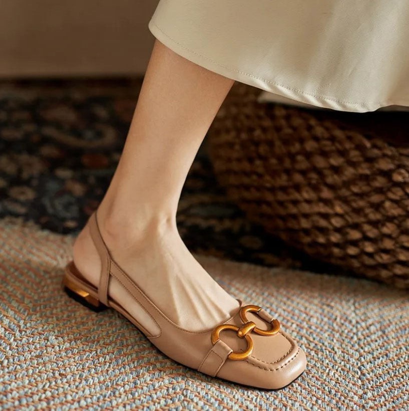 Nude leather slingback sandals featuring square toe and gold buckle trim