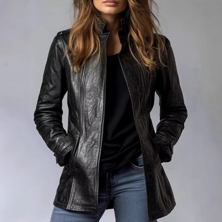 Close-up of black leather tailored jacket with stand collar and zip pockets
