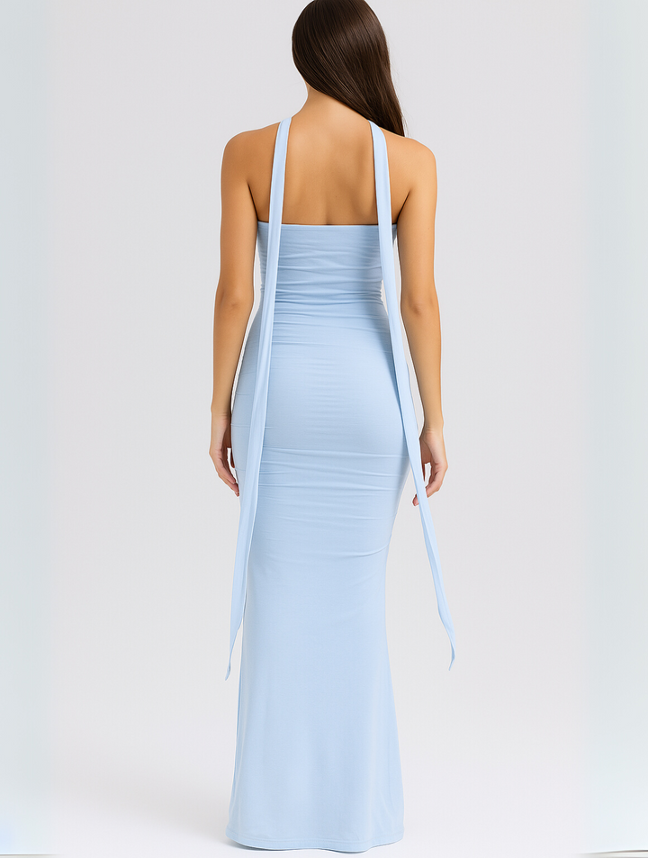Rear view of blue strapless maxi dress showing long choker straps