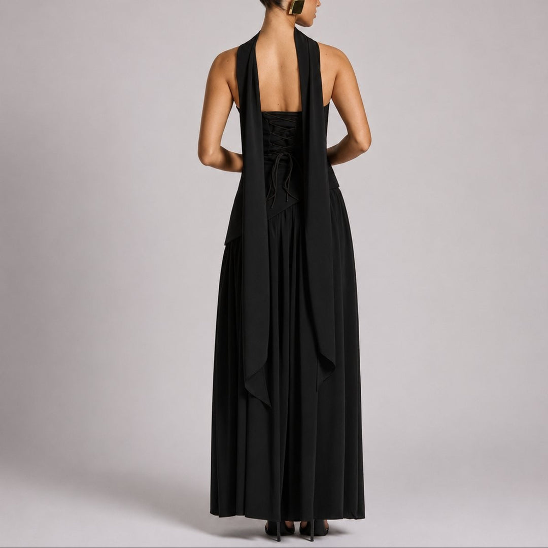 Rear view of black strapless gown highlighting corset lace-up back