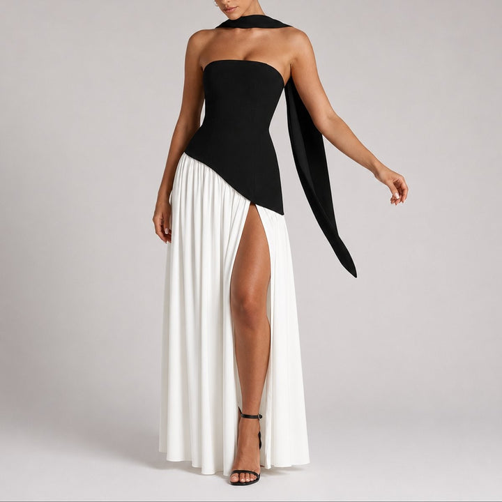 Monochrome strapless gown with black bodice and white pleated split skirt