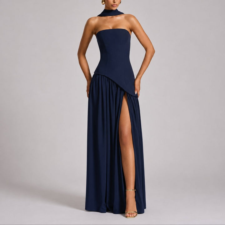Navy strapless maxi dress with halter scarf collar and dramatic leg slit