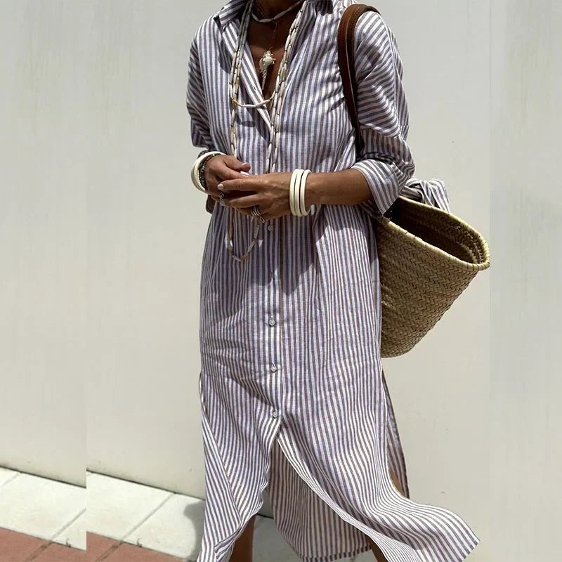 Grey and white striped maxi shirt dress with layered necklaces and straw tote