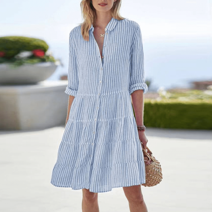 Blue and white striped shirt dress with tiered skirt and turned-up cuffs