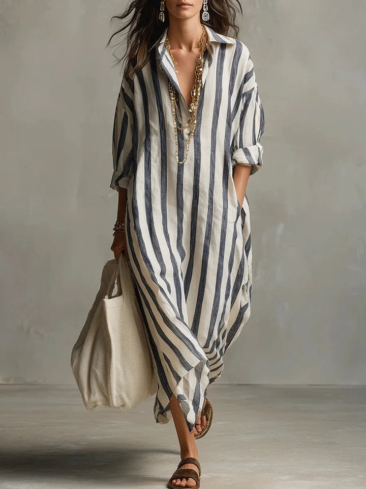 Navy and white striped maxi shirt dress with collared neckline and long sleeves