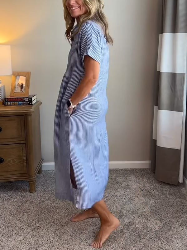 Side view of blue striped midi dress showing side split hem