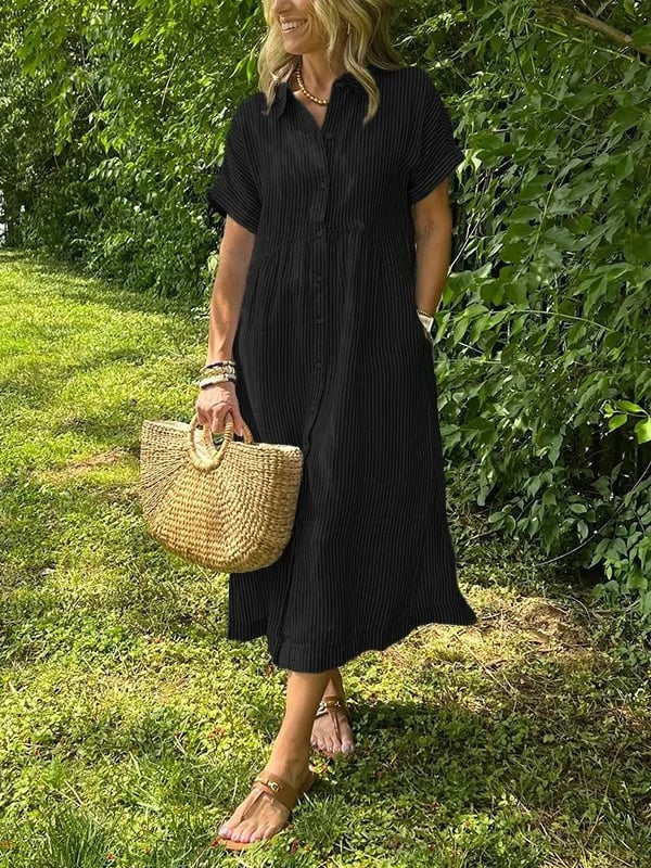 Black pinstriped midi shirt dress worn with straw basket bag