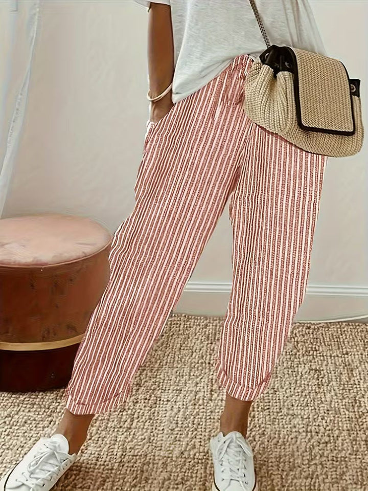 Red and white striped wide-leg trousers with cuffed hems and cropped fit