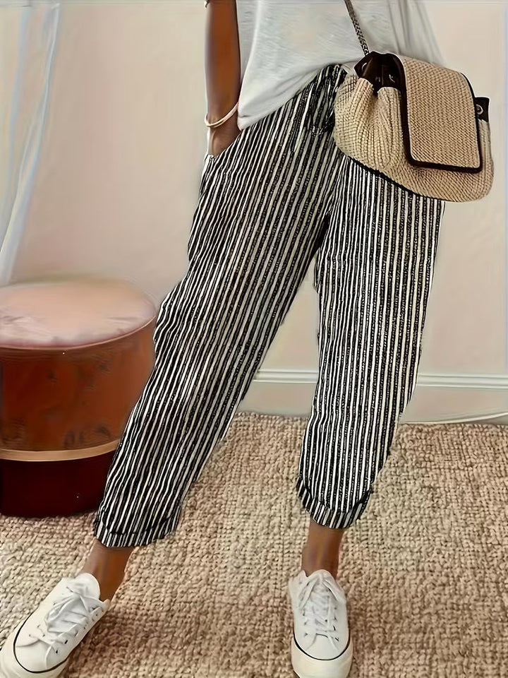 Black and white striped wide-leg trousers with cropped, cuffed ankle length