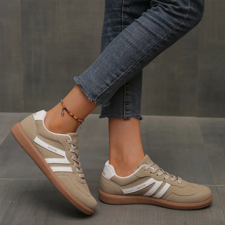 Beige suede lace-up trainers with white stripes and gum sole