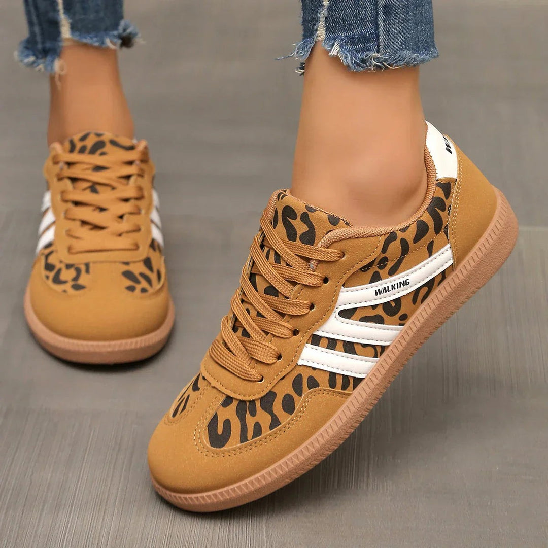 Leopard print lace-up trainers with white stripes and gum sole