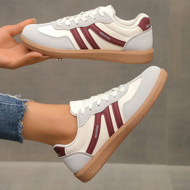 White leather trainers with burgundy stripes and gum sole