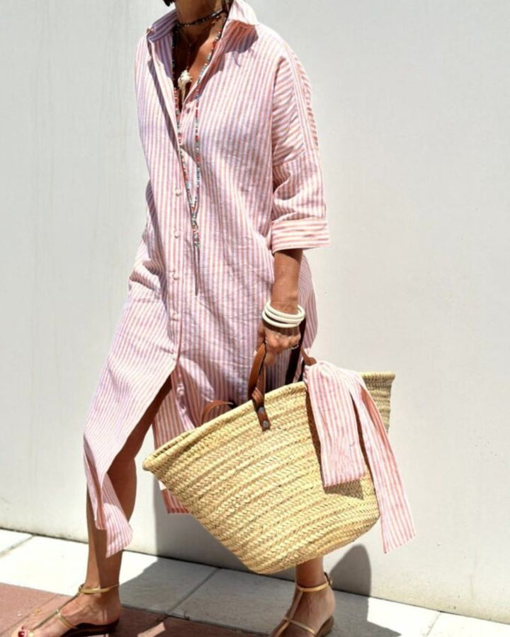 Pink and white striped midi shirt dress with woven straw beach bag