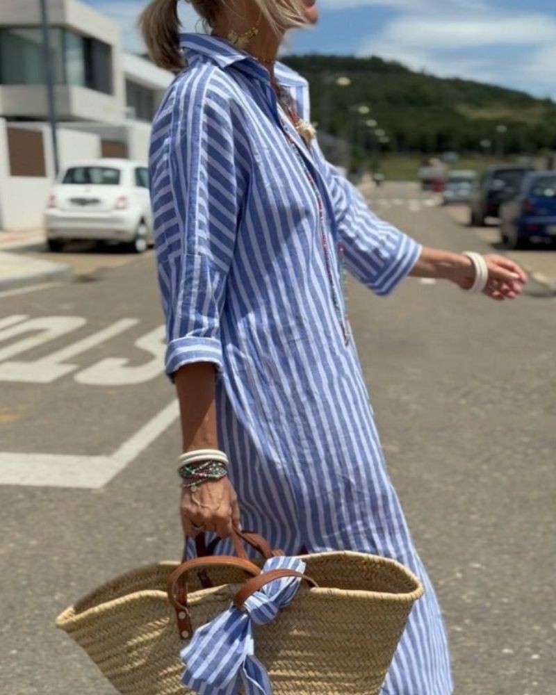 Blue and white striped midi shirt dress paired with straw basket bag
