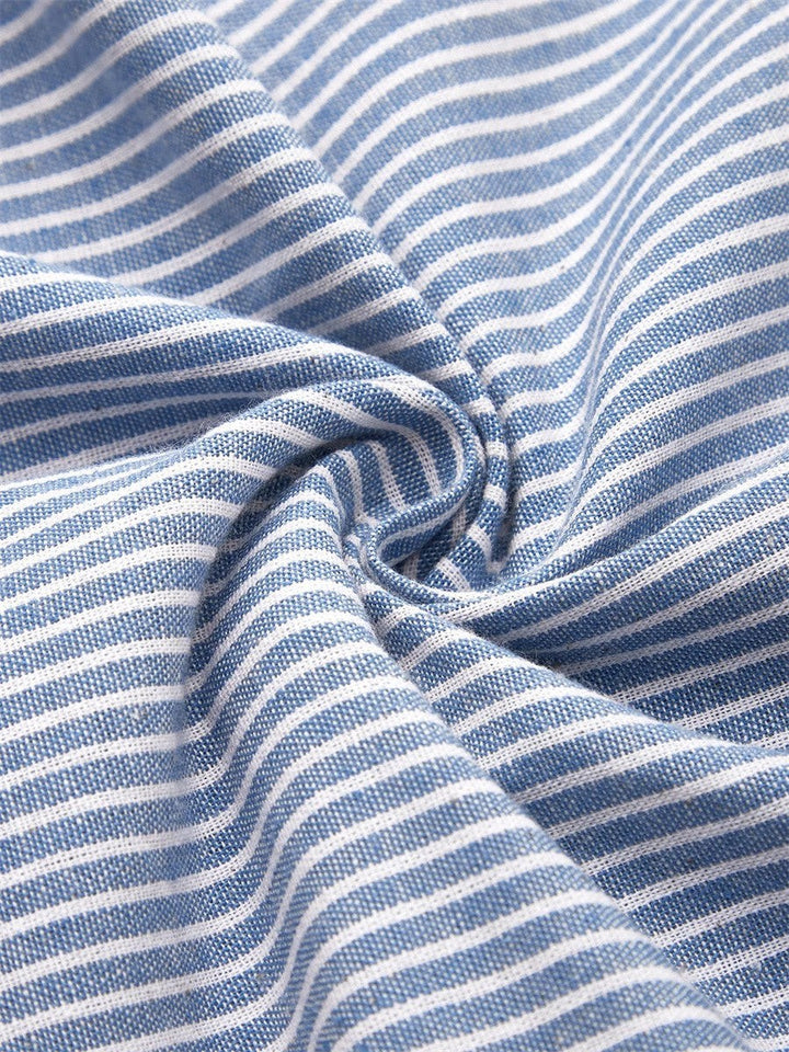 Close-up of woven blue and white striped cotton fabric texture