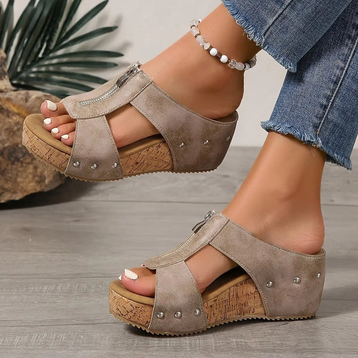 Taupe cork wedge sandal paired with matching pair, showcasing cushioned footbed