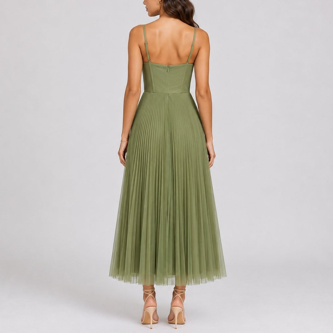 Rear view of olive green pleated midi dress showing corset seaming and adjustable straps