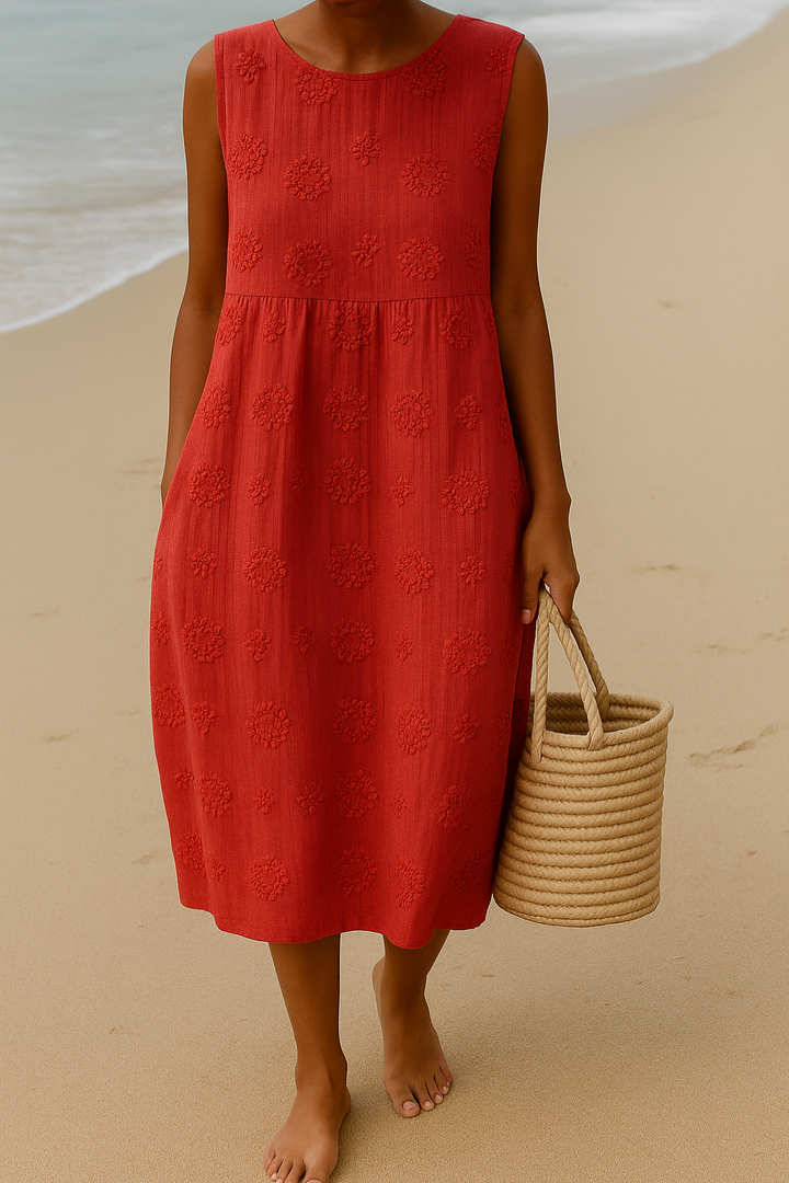 Red sleeveless midi dress showcasing embroidered floral pattern and scoop neckline