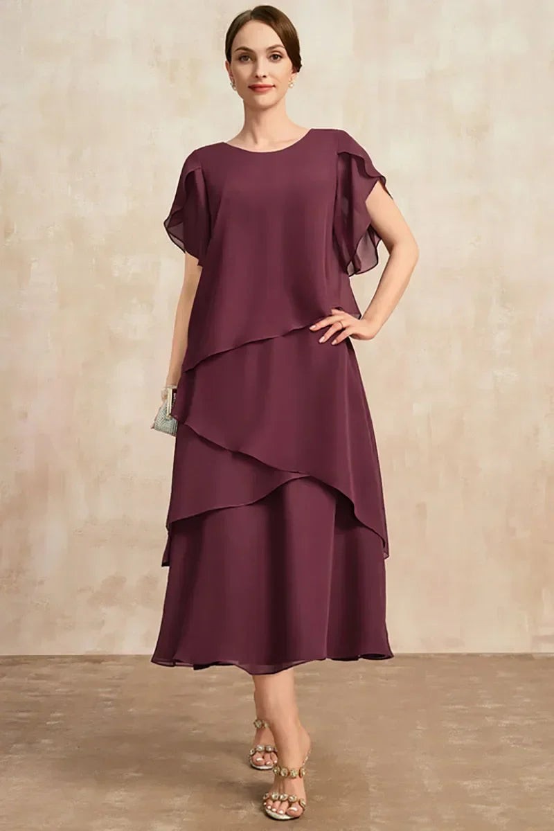 Wine-coloured layered chiffon dress with ruffled cap sleeves, worn full-length