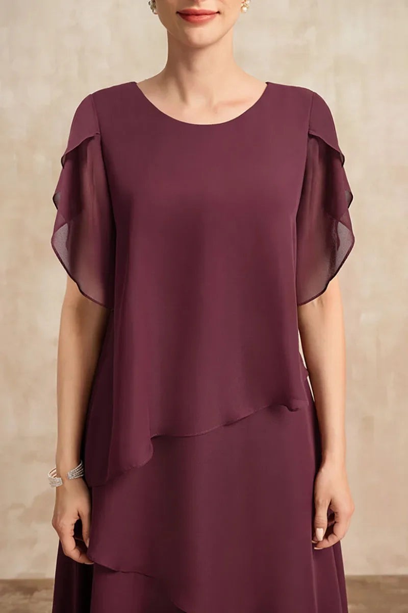 Close-up of plum chiffon dress showing scalloped flutter sleeve detailing