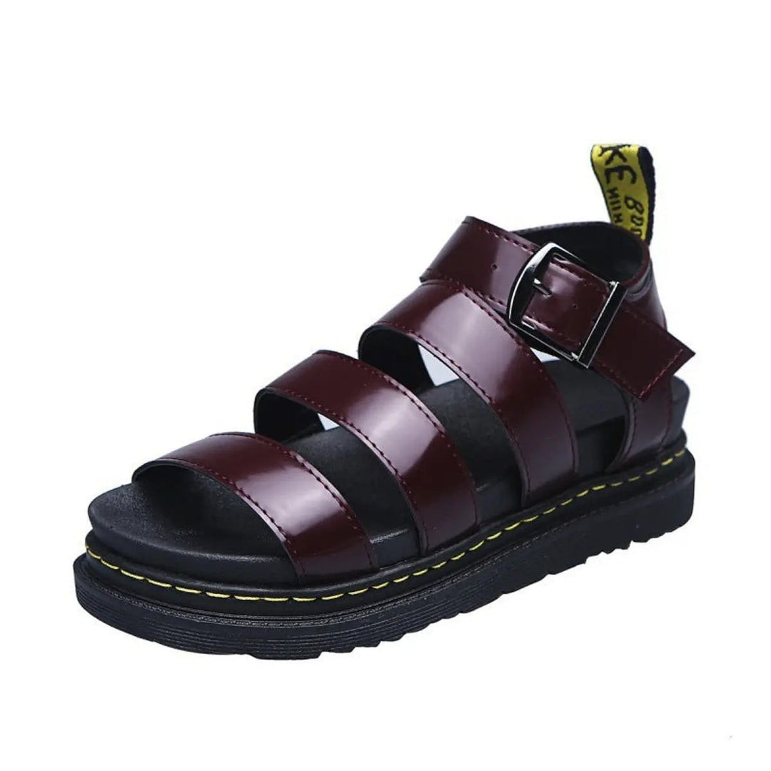 Burgundy leather gladiator-style sandal with buckled ankle strap and cleated sole
