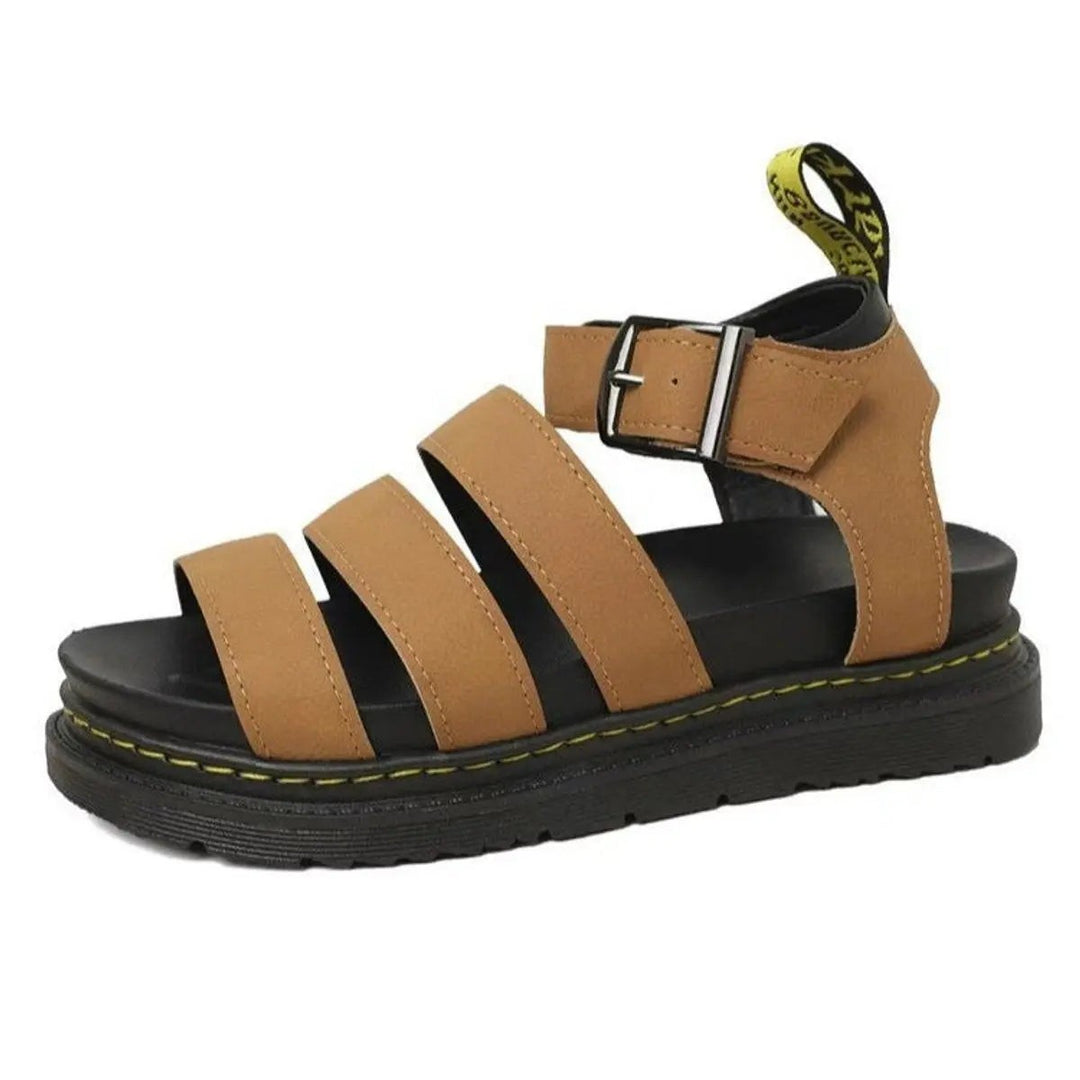 Tan leather platform sandal featuring triple straps and adjustable buckle fastening