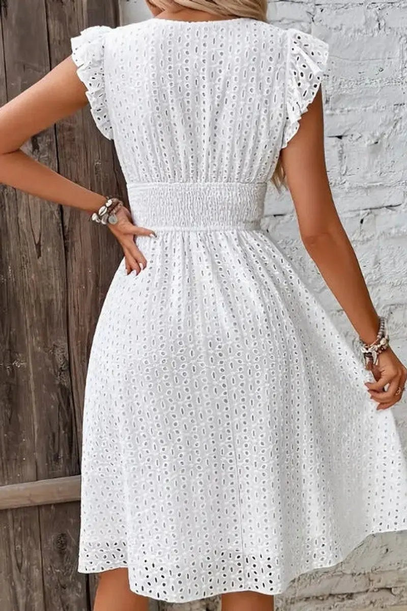 White broderie anglaise midi dress with ruffled sleeves and shirred waist, back view