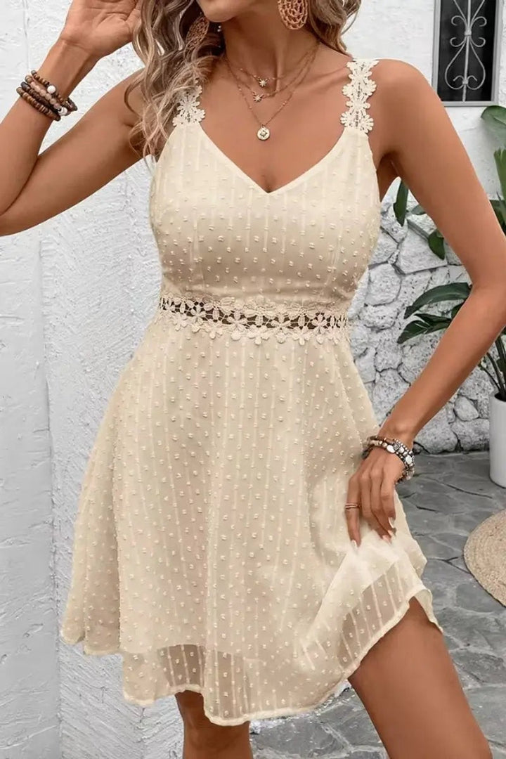 Cream Swiss dot cocktail dress with lace straps and floral waist trim