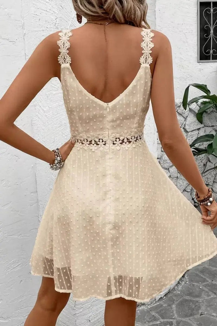 Cream lace-strap dress showing sheer hem and crochet waist detail, back view
