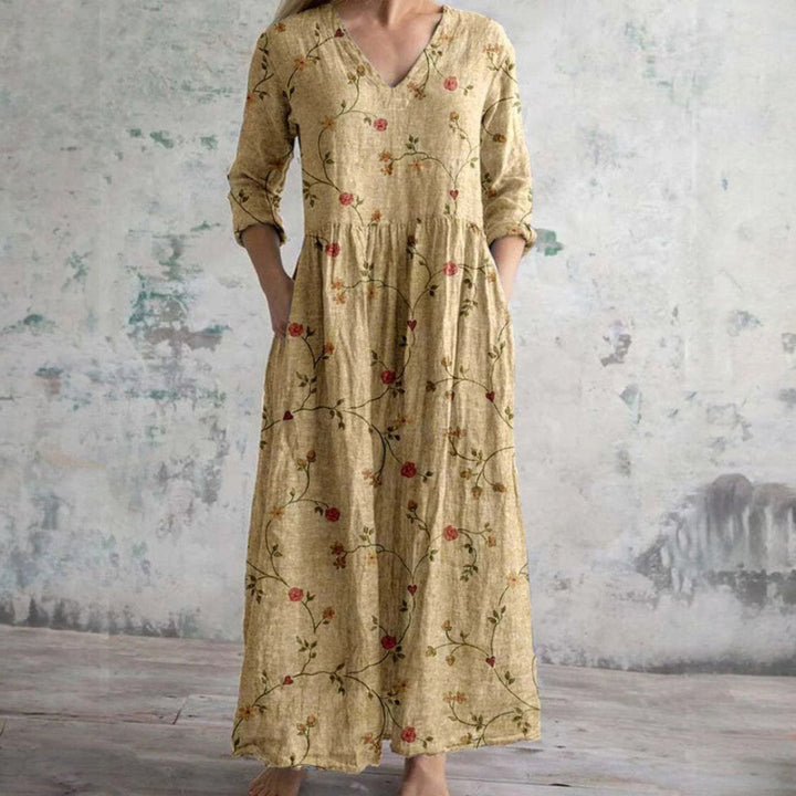 Beige floral maxi dress with V-neck and three-quarter sleeves, rose vine print