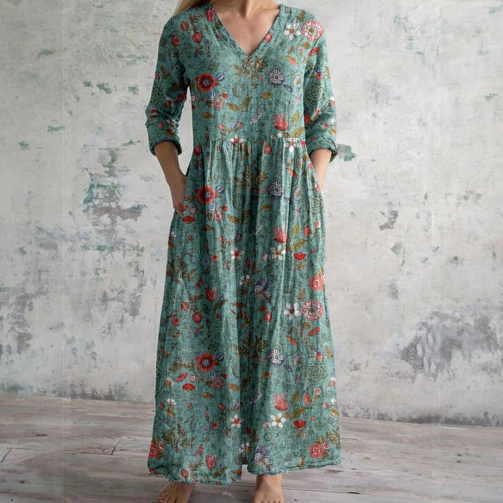 Sage green floral maxi dress featuring V-neck, long sleeves and botanical print