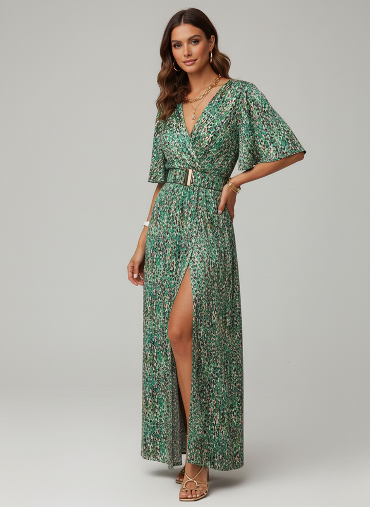 Green patterned wrap maxi dress featuring belted waist and high leg slit, styled with gold sandals