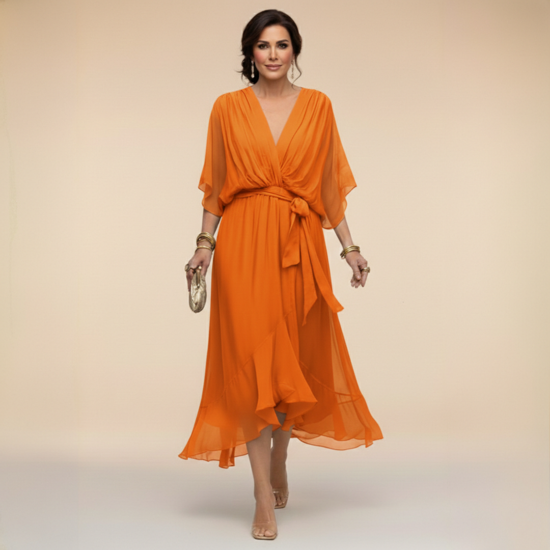 Burnt orange chiffon wrap dress with flowing sleeves and tied belt