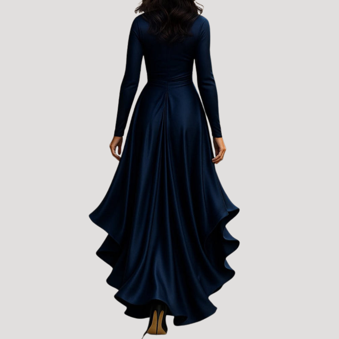 Rear view of navy satin wrap dress showing flowing high-low ruffled skirt