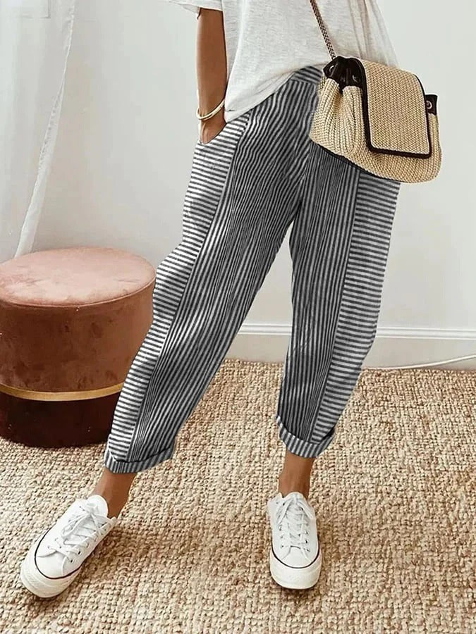 Grey striped cropped trousers with contrast panel and turned-up hems