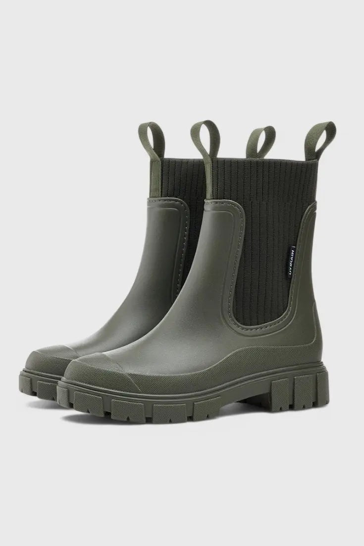 Olive green Chelsea ankle boots with ribbed knit trim and cleated sole